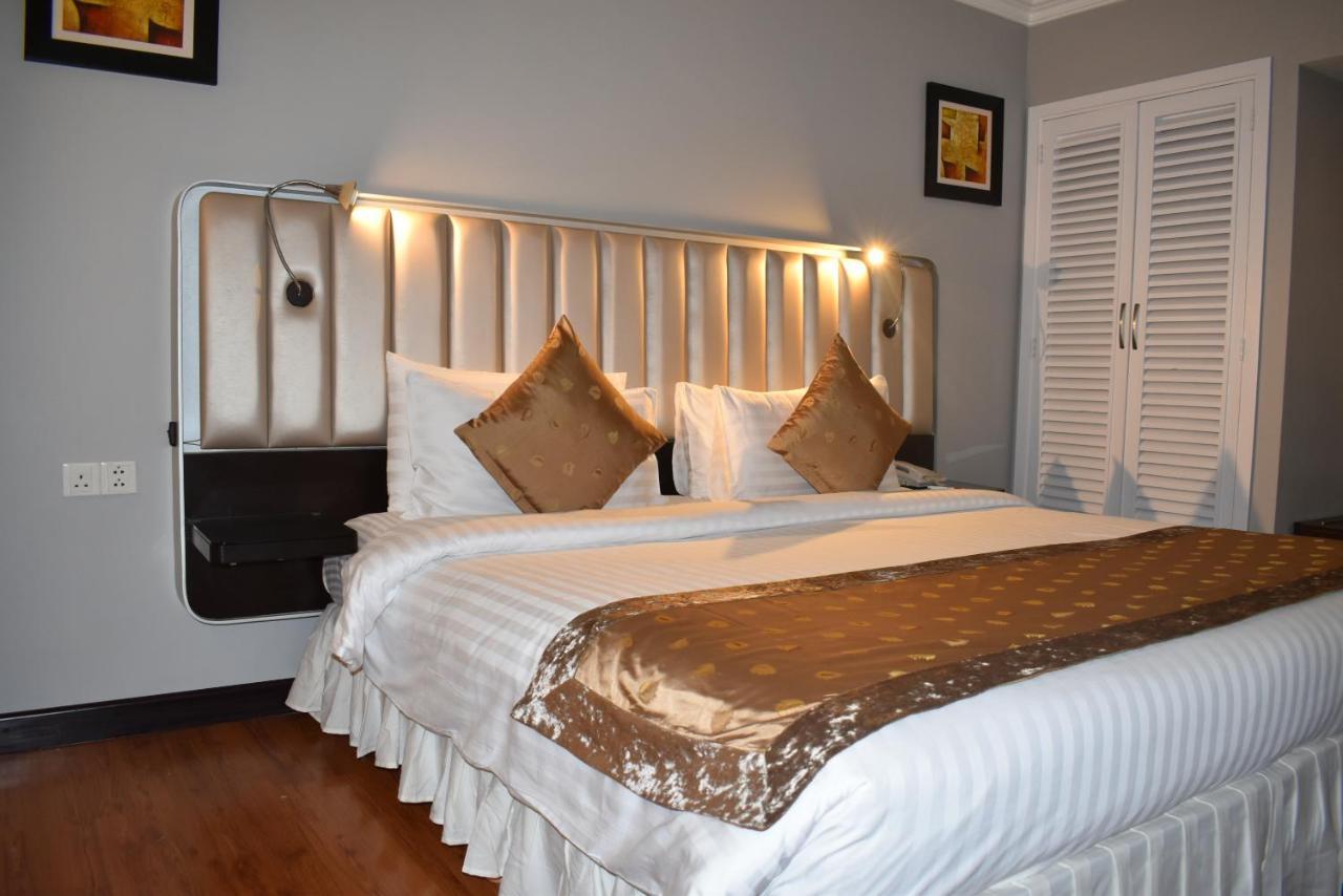 라마다 플라자 바이 윈덤 카라치 에어포트 호텔 외부 사진 A bedroom at the hotel